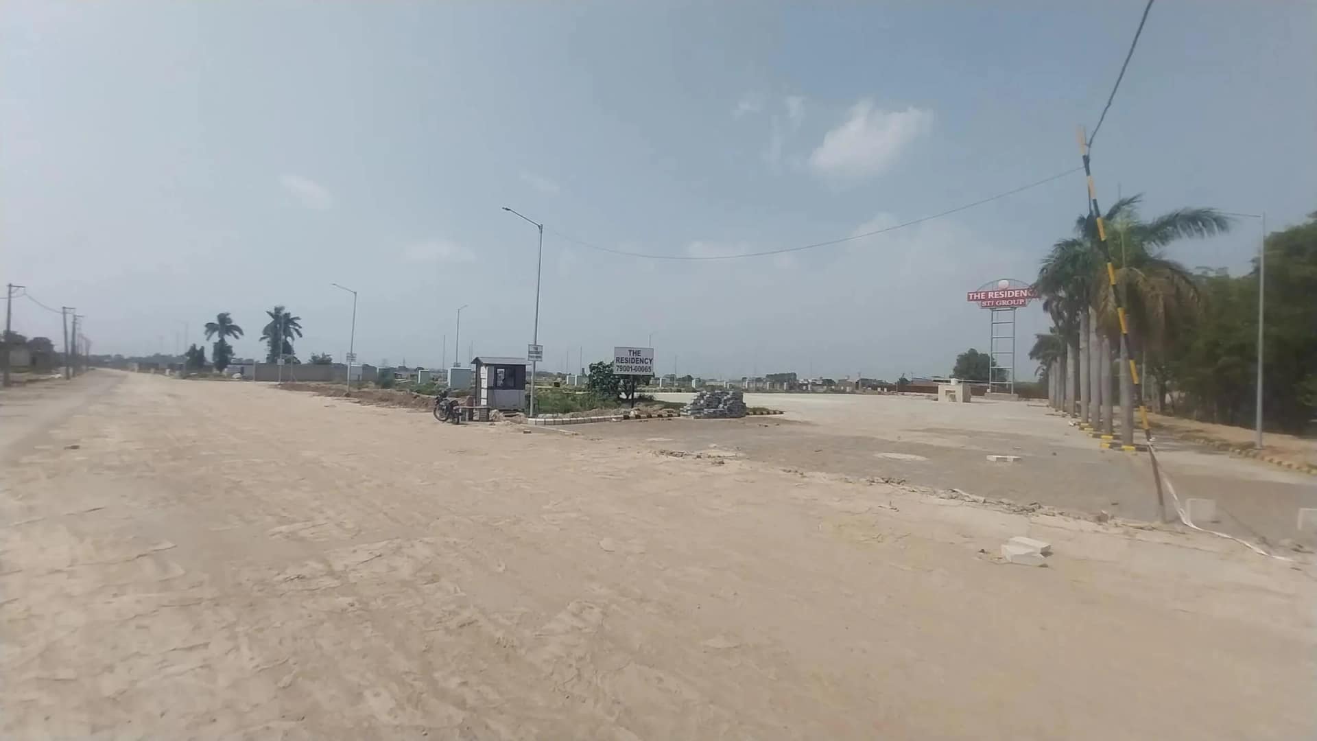 MCC The Residency – Entrance and Approach Road Wide view of the approach road and entrance at MCC The Residency, Zirakpur Patiala Highway