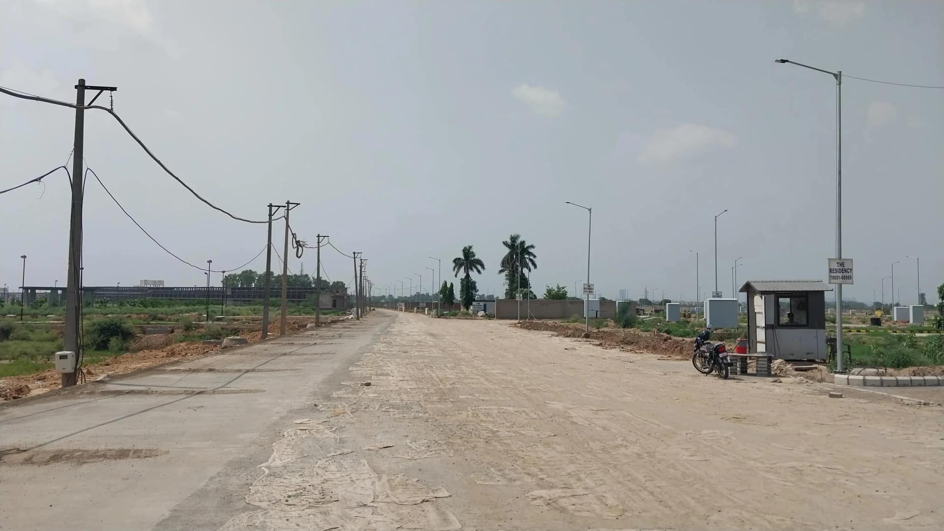 MCC The Residency – Internal Road Internal road with street lights and security cabin at MCC The Residency